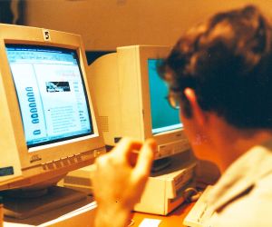 2nd Feb 2000, the back of a guy looking at a computer screen with the first Netribution website on it.