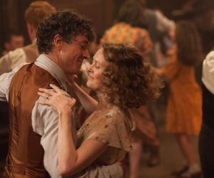 A still from film Jimmy's Hall - Barry Ward and Simone Kirby embrace dancing as the world around them dances out of focus.